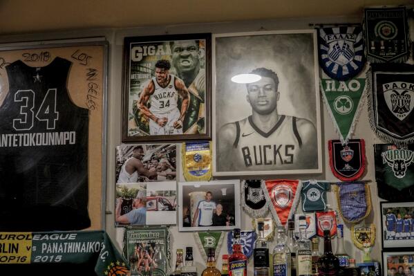 Giannis biggest fans watch celebrate title a world away AP News
